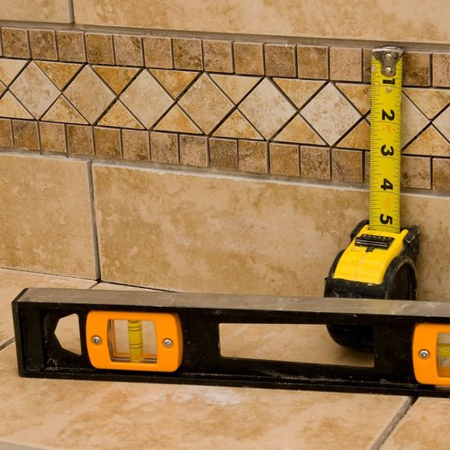 Level and Measuring Tape laid up against a Tile Wall From Walnut Carpet | 16790 East Johnson Drive, El Monte, California 91745
